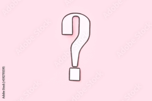 Paper question mark on pink...
