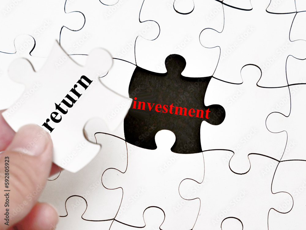 Fototapeta premium Return investment, text words typography written under jigsaw puzzle, life and business motivational inspirational
