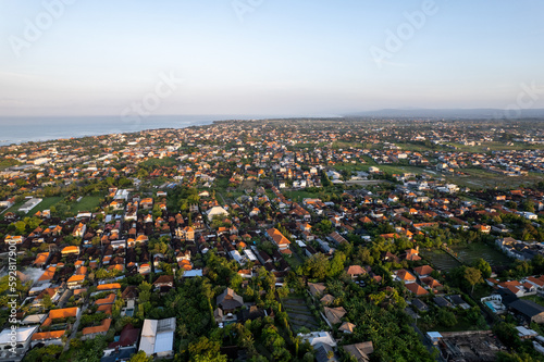 Aerial view of the Canggu area, one of the Bali beachside areas experiencing massive development. The conversion of agricultural land into an entertainment center and housing.