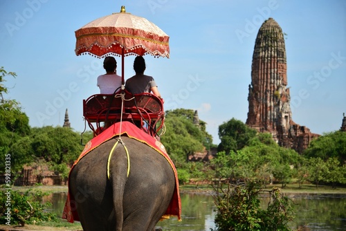 A couple riding elephant in Ayutthaya, Thailand