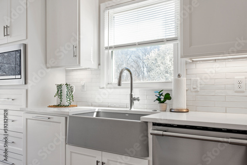 Modern Minimalism Kitchen Design with White Tiles, Quartz Countertops, and Stainless Steel Appliances