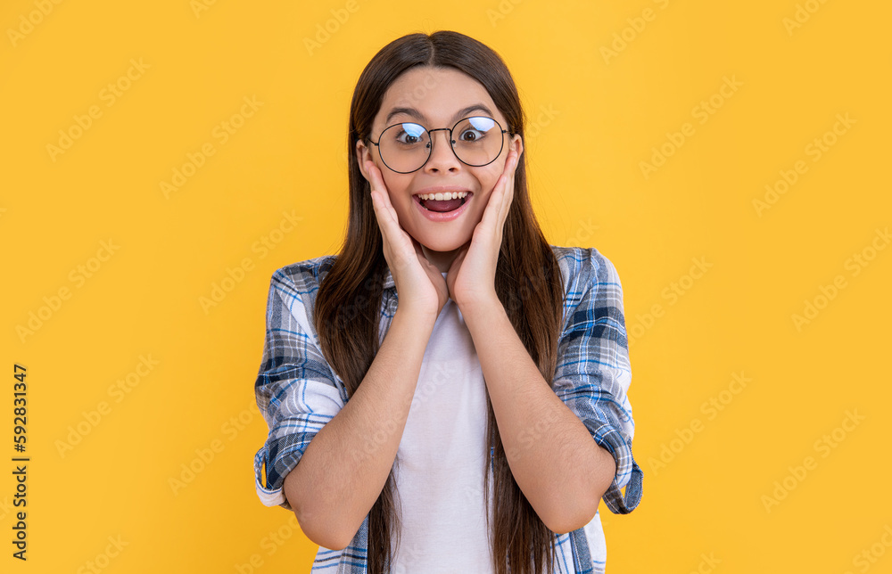 amazed teenager girl on background. photo of teenager girl with long hair wearing glasses.