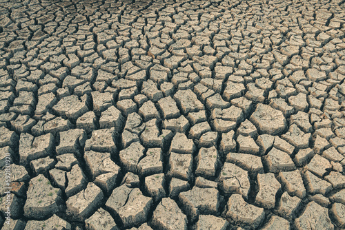 Landscape ground cracks drought crisis environment background.