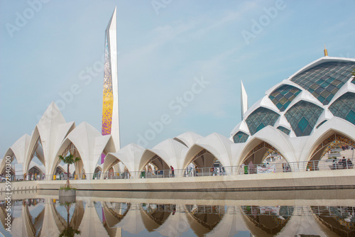 Landscape exterior mosque with slightly cloudy skies in the morning.  photo