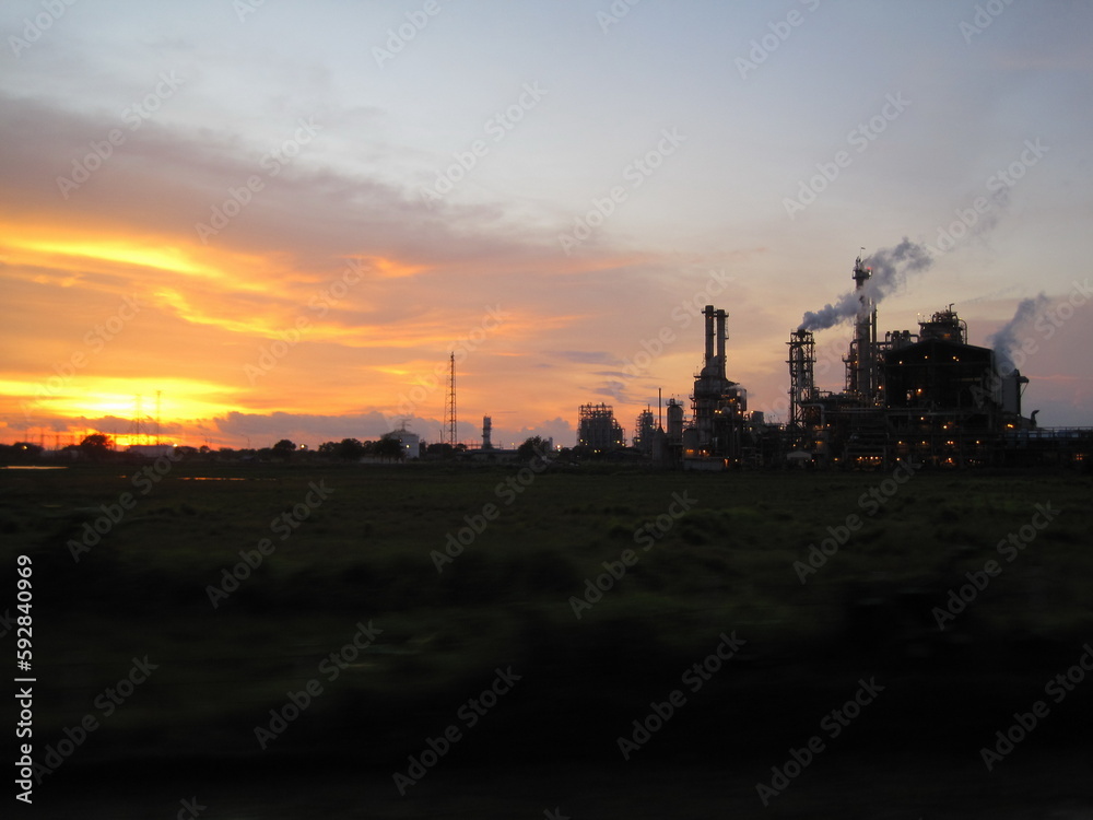 Oil refinery at sunset in the countryside of Cilegon, Indonesia. Oil and gas industry.