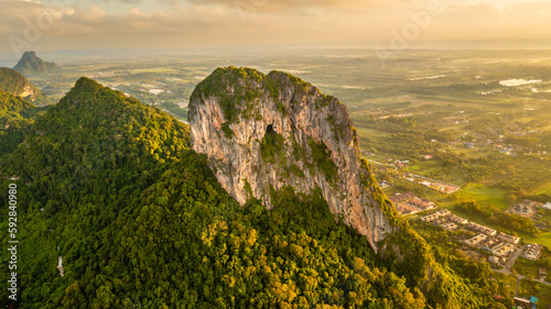 Mountain of Phatthalung city, view from above in the morning with golden sun light. Aerial view panorama of Khao Ok Thalu ,Phatthalung, Thailand.