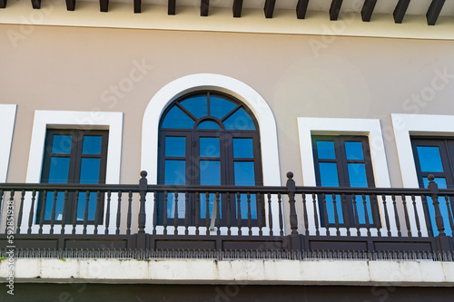 balcony railings on arch window. balcony railings facade. balcony railings outdoor.