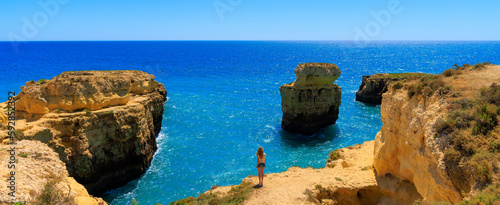 Woman enjoying Algarve coast in Portugal