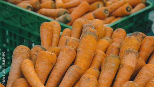 A bountiful basket of crisp, orange carrots, radiating freshness and health, waiting to be savored.