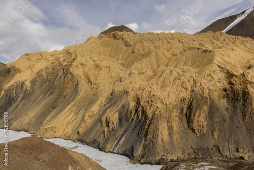 Landscape in Lamayuru, Ladakh - known as the ‘Moonland’, due to its unique terrain that resembles the surface of the moon. Barren mountains, rocky outcrops, create a stark and otherworldly atmosphere.