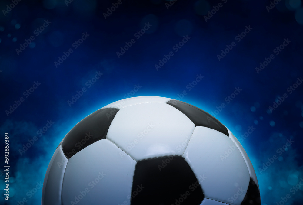 Football ball on blue smoke background