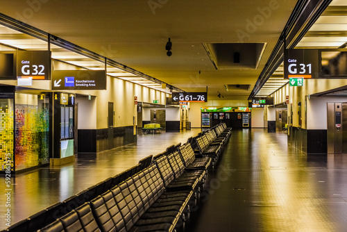 illuminated hall with many seats in the morning at the airport