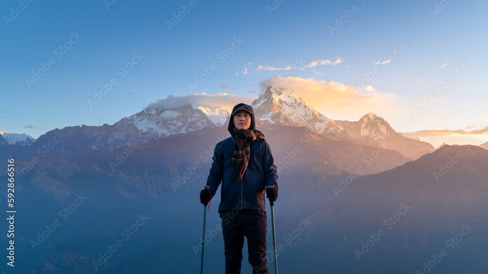 A young traveller trekking in Poon Hill view point in Ghorepani, Nepal..
