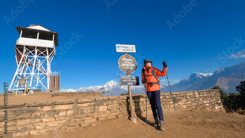 A young traveller trekking in Poon Hill view point in Ghorepani, Nepal