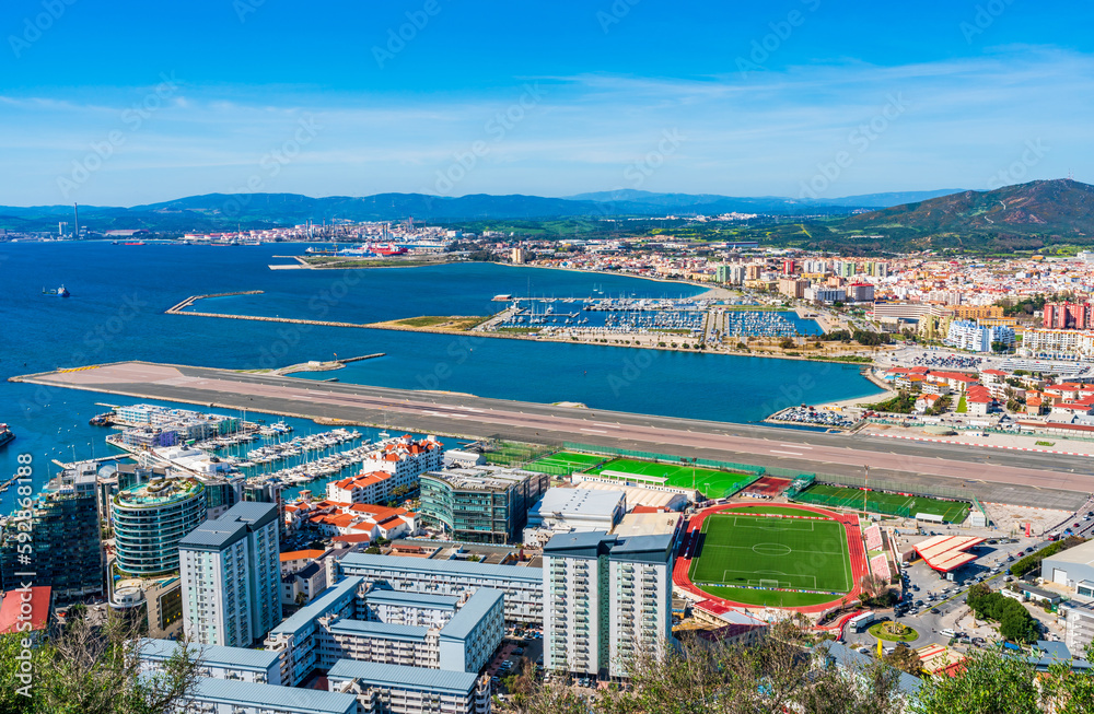 View of runway of the Gibraltar airport and Spanish town La Linea de Conception from the Upper Rock. UK