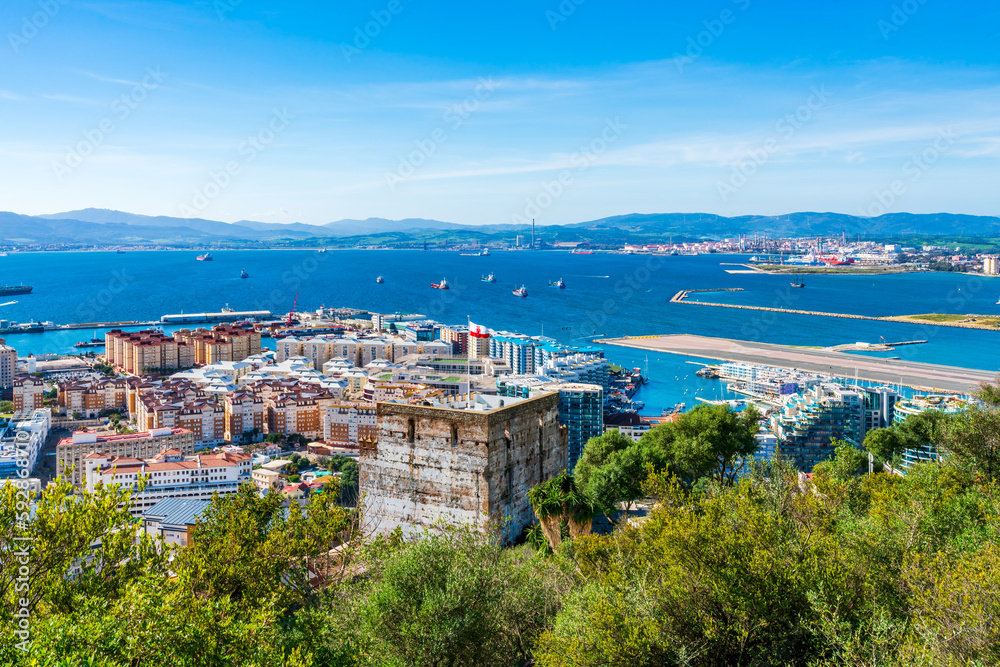 View of Gibraltar town, Moorish Castle Tower and Gibraltar Bay from the Upper Rock. UK