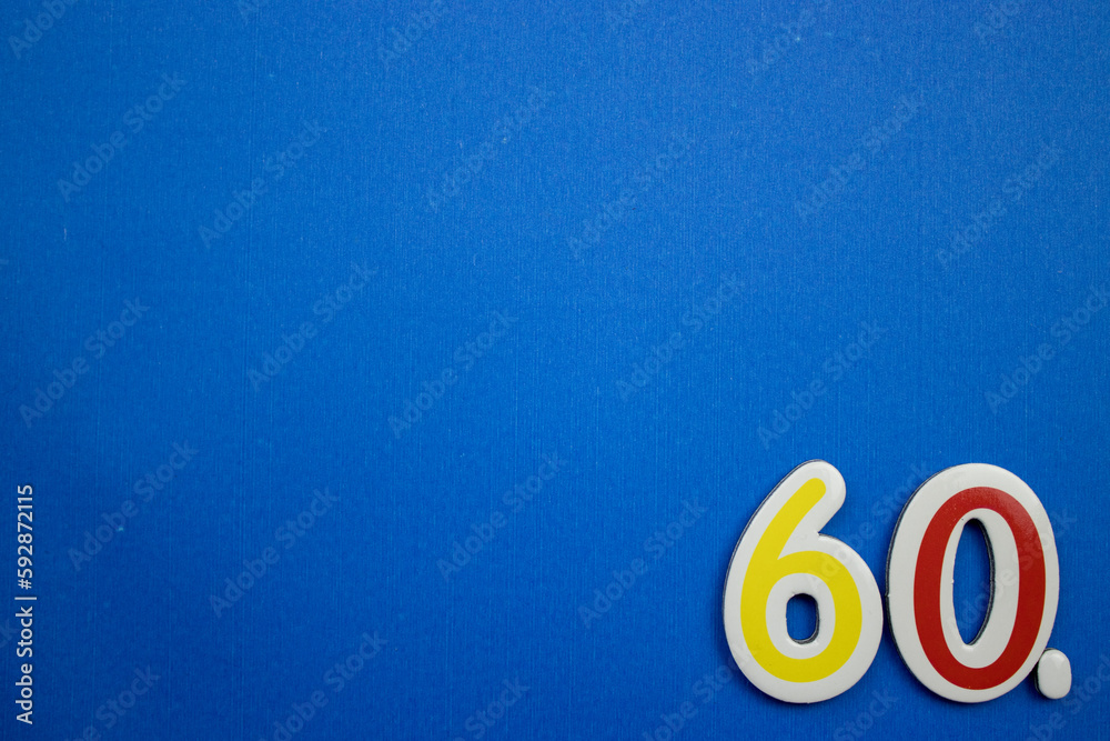 60. number of. Placed on the edge of the blue background, photographed ...