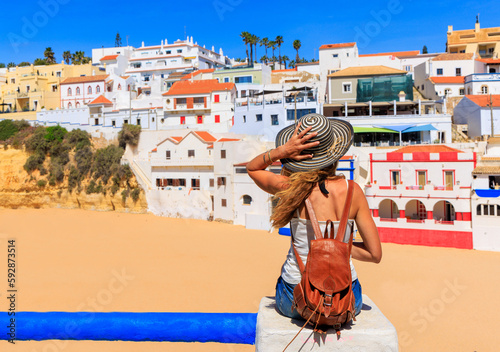 Woman tourist visiting Carvoeiro- Travel in Algarve, Tourism in Portugal