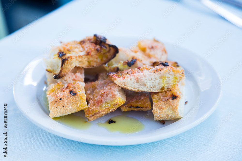 Toasted bread with tomato and oil. Traditional Spanish tapa. Toasted bread with tomato and oil. Traditional Spanish tapa.
