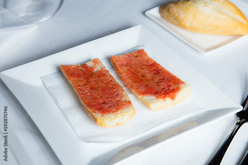 Toasted bread with tomato and oil. Traditional Spanish tapa. Toasted bread with tomato and oil. Traditional Spanish tapa.