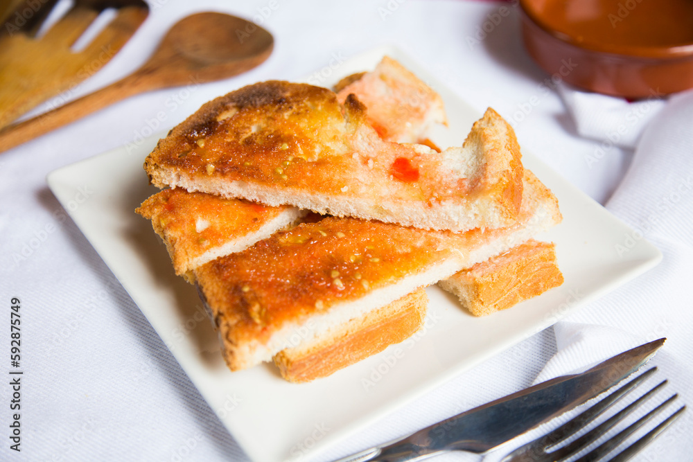 Toasted bread with tomato and oil. Traditional Spanish tapa. Toasted bread with tomato and oil. Traditional Spanish tapa.