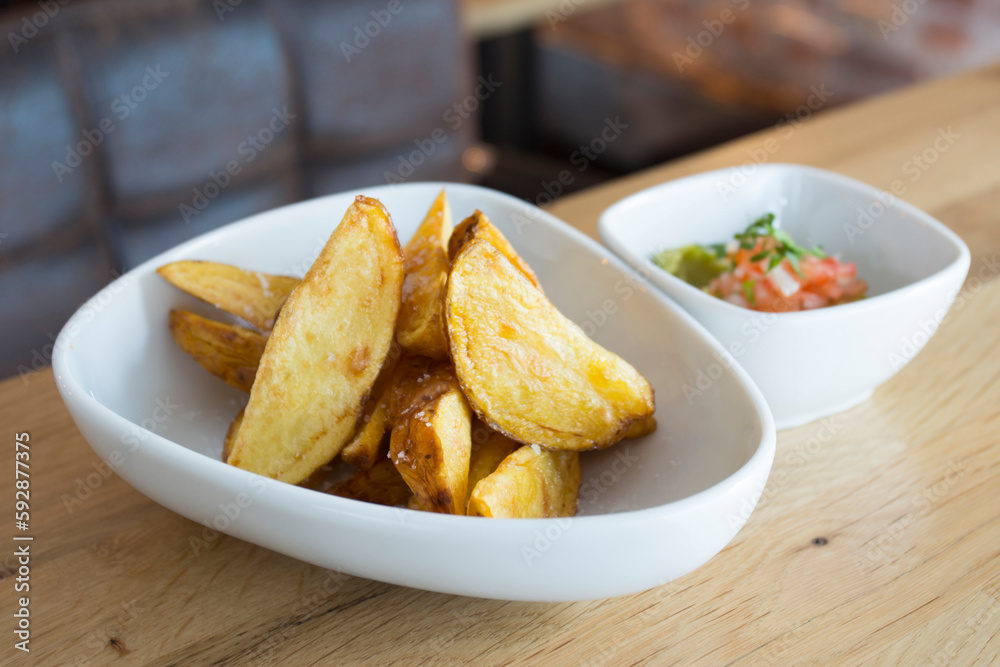 French Fries are potatoes that are made by cutting them into batons and frying them in hot oil until golden brown and crisp. French Fries are potatoes that are made by cutting them into batons and frying them in hot oil until golden brown and crisp.