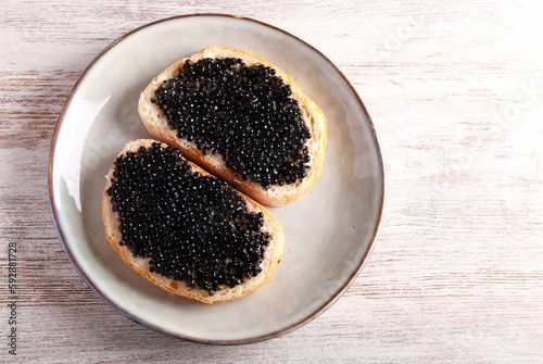 Black caviar over slices of bread