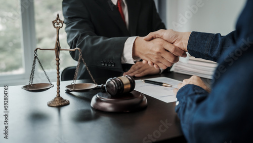 Shaking hands  Lawyers and clients discuss the rights and liberty of children and women.