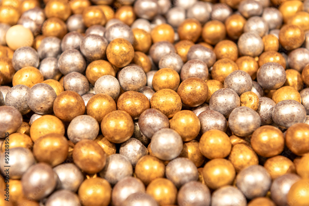 Round dragee. Round chocolate candies close-up. Sweet shop.