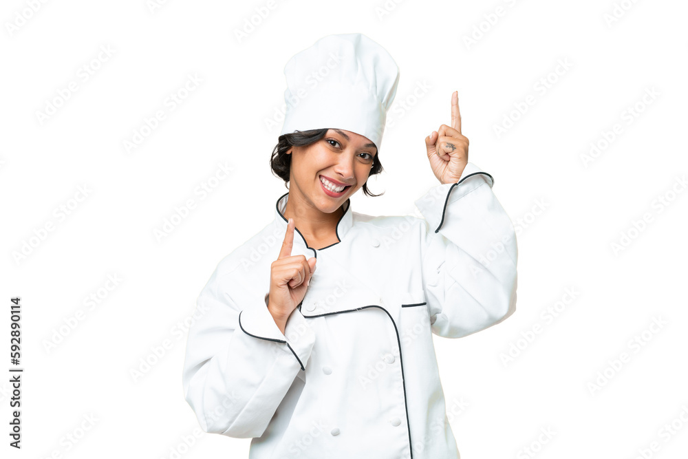 Young chef Argentinian woman over isolated background pointing finger to the laterals and happy Young chef Argentinian woman over isolated background pointing finger to the laterals and happy