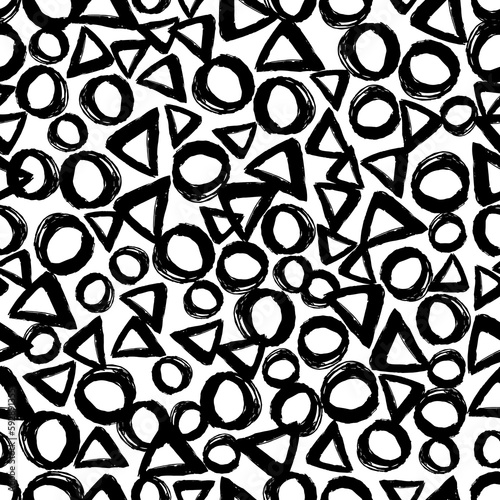 Seamless pattern with careless strokes in the form of a circle and triangles. Abstract background made using of brush smears. Black and white hand drawn texture.