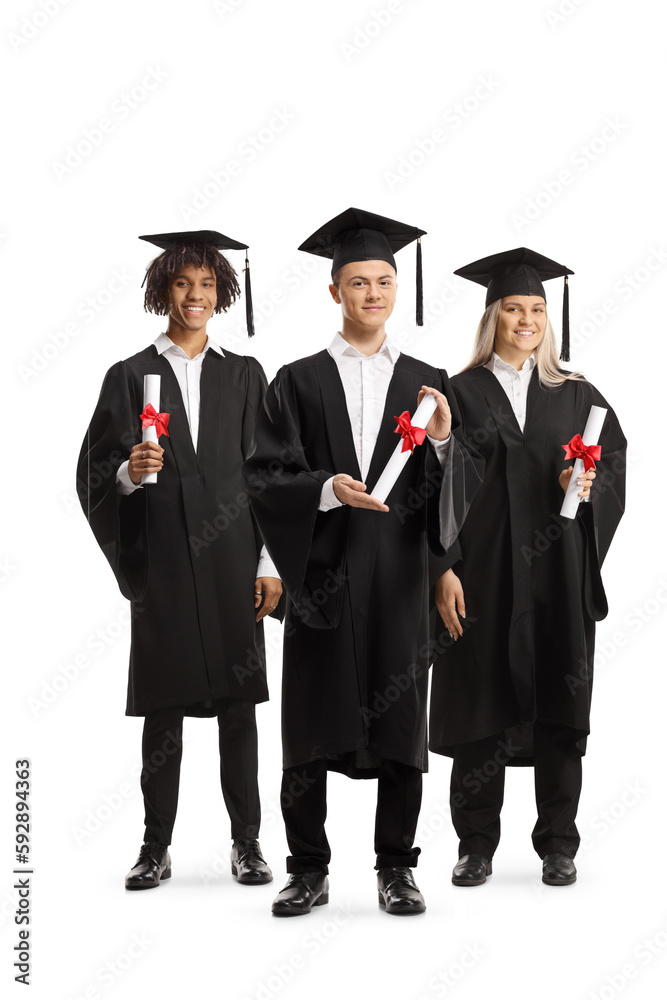 Group of graduate students in gowns holding diplomas Group of graduate students in gowns holding diplomas
