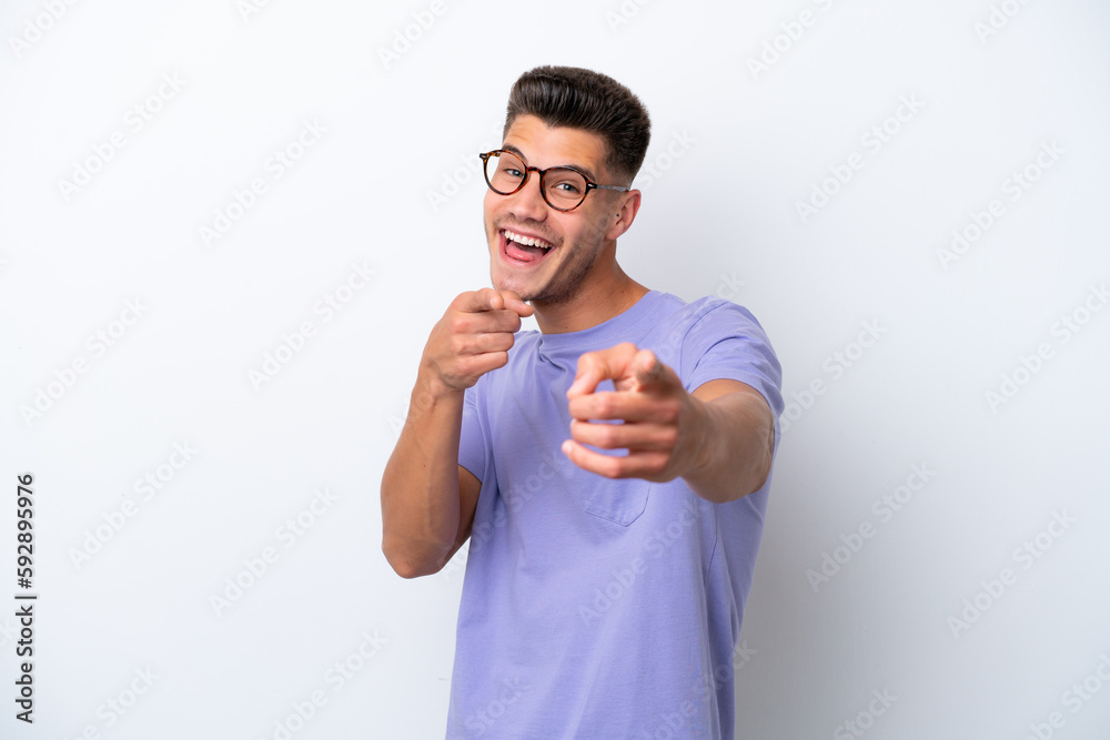 Young caucasian man isolated on white background pointing to the front and smiling Young caucasian man isolated on white background pointing to the front and smiling