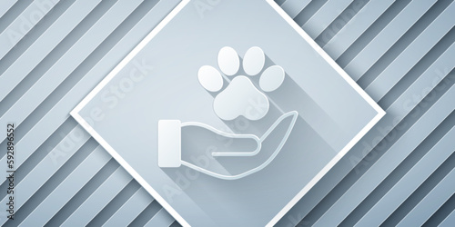 Paper cut Hands with animals footprint icon isolated on grey background. Pet paw in heart. Love to the animals. Paper art style. Vector