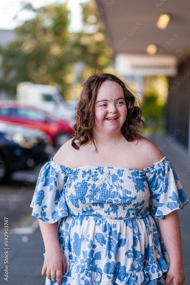 Portrait of seventeen year old girl with down syndrome in the community Portrait of seventeen year old girl with down syndrome in the community