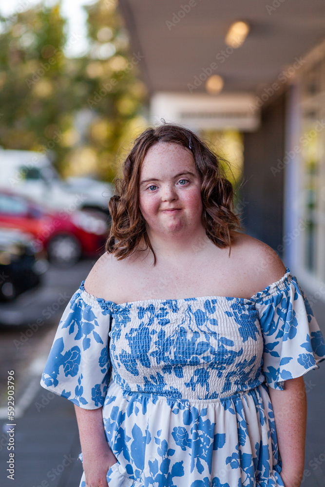 Urban portrait of aussie teen with down syndrome outside shopping centre Urban portrait of aussie teen with down syndrome outside shopping centre
