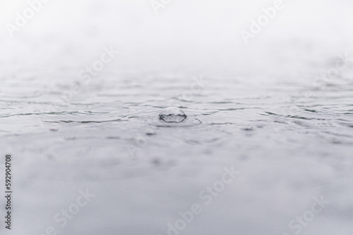 Puddle with Rain Falling - 水たまりに雨が落ちる (ID: 592904708)