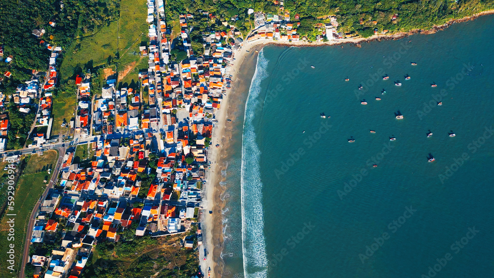 Aerial view of the Brazilian coastline and the little fisherman's town in Santa Catarina, Brazil