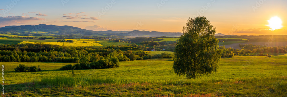 panoramic view on Kaczawskie mountains during sunset in Poland