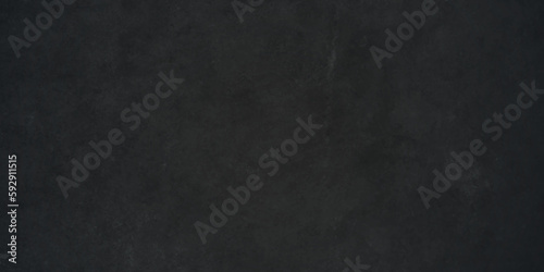 Dark black stone wall grunge backdrop texture background. monocrome slate grunge concrete wall black backdrop vintage marbled textured border background. 