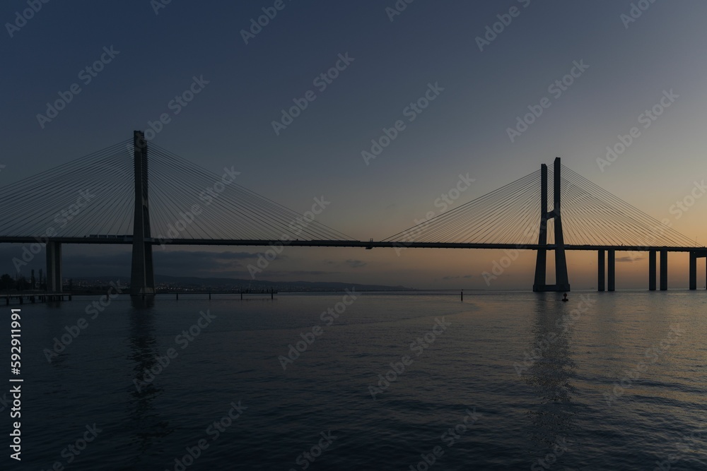 Vasco da Gama Bridge at sunrise in Parque das Nacoes, Lisbon, Portugal Vasco da Gama Bridge at sunrise in Parque das Nacoes, Lisbon, Portugal