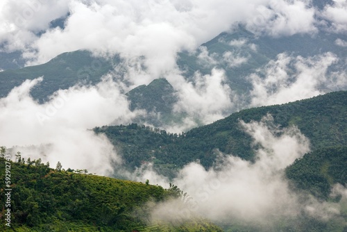 Beautiful view of clouds slowly rising in the morning in the mountains of Vietnam highlands