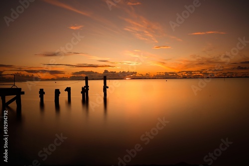 Scenic view of a beautiful sunset over the ocean in the sky in the evening