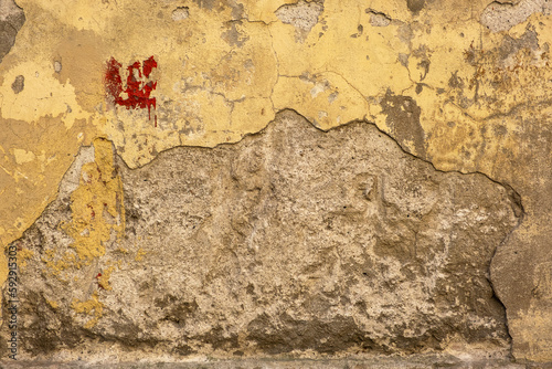 Old yellow plaster on the wall. vintage background