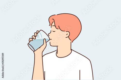 Thirst man drinks water from transparent glass, wanting to refresh himself after walking