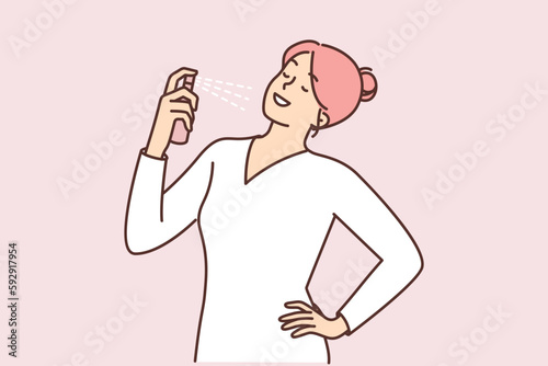 Woman holding vial with fragrant perfume preening before going to party or date with boyfriend