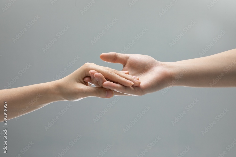 Beautiful shot of two hands touching each other
