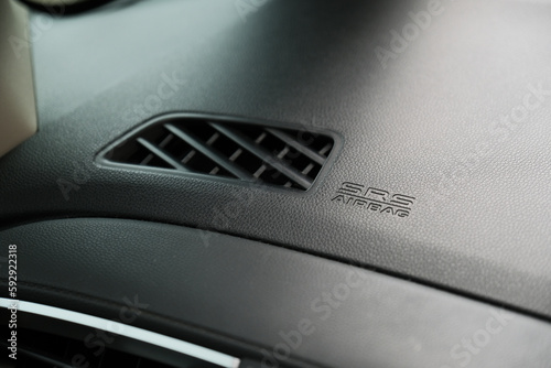 SRS (Supplemental Restraint System) airbag sign on car dashboard photo