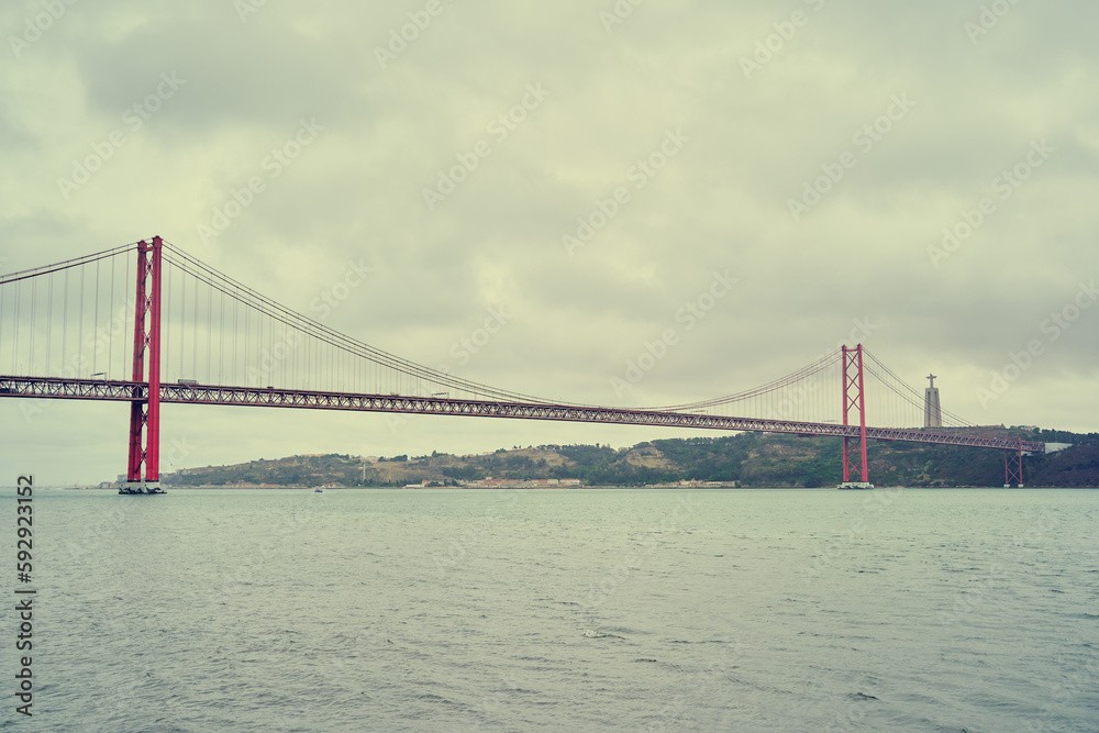 Beautiful landscape with suspension 25 April bridge bridge over the Tagus river in Lisbon, Portugal. Beautiful landscape with suspension 25 April bridge bridge over the Tagus river in Lisbon, Portugal.
