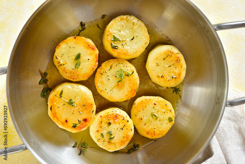Fondant potatoes in pan Fondant potatoes in pan